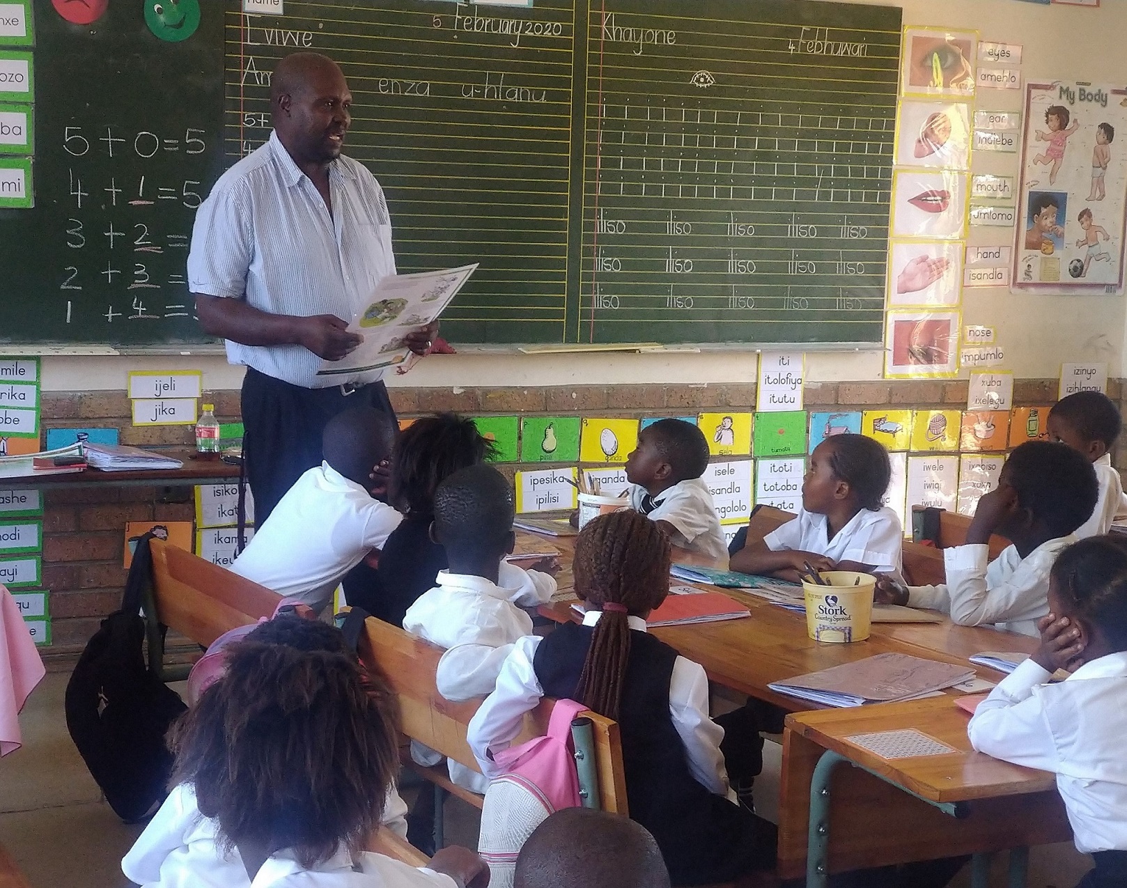 Thuso Moss reading to learners on World Read Aloud Day. 