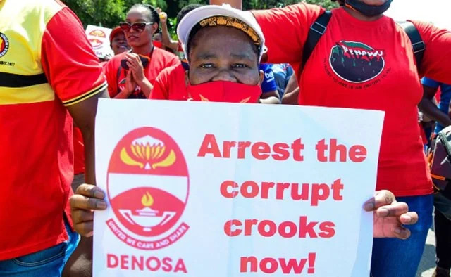 South African trade union members take mass strike action against corruption in October 2020. [Photo by Darren Stewart/Gallo Images via Getty Images]