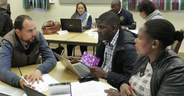 Lecturers engaging with each other during the course