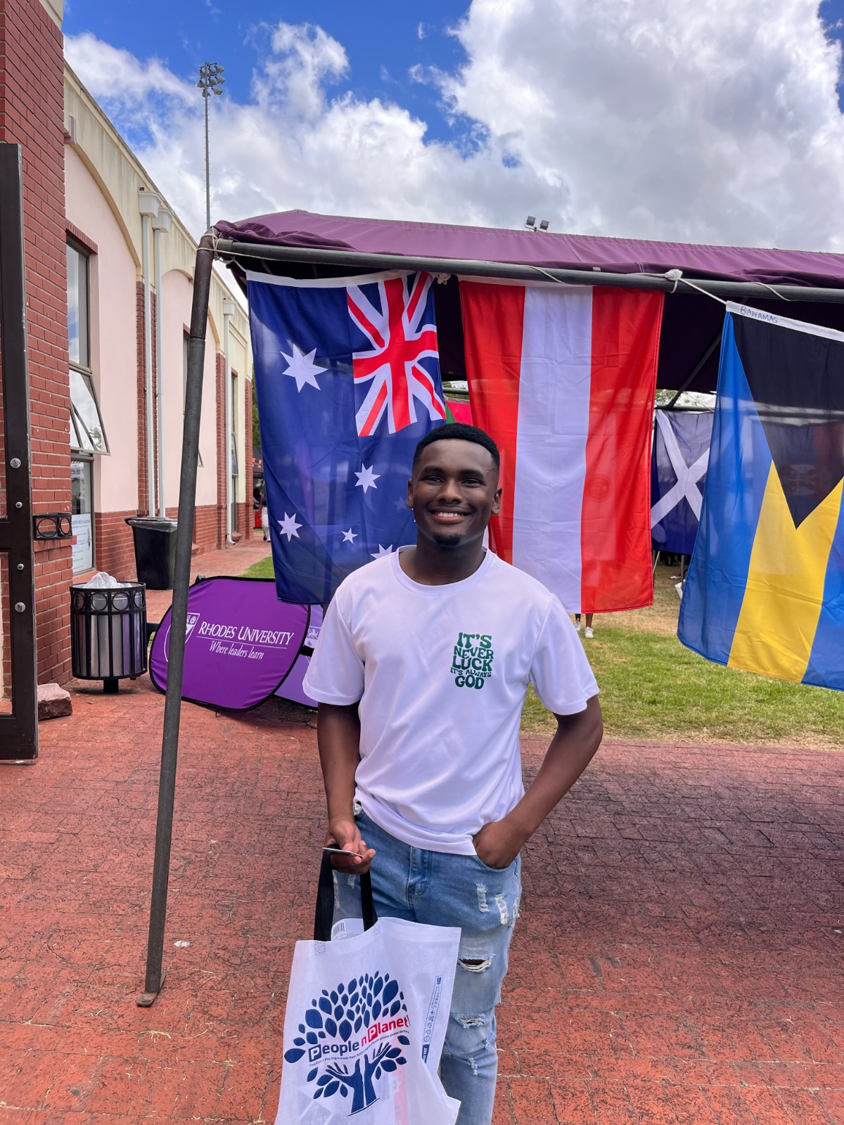 Sinelizwi standing on campus as a newly registered first-year student