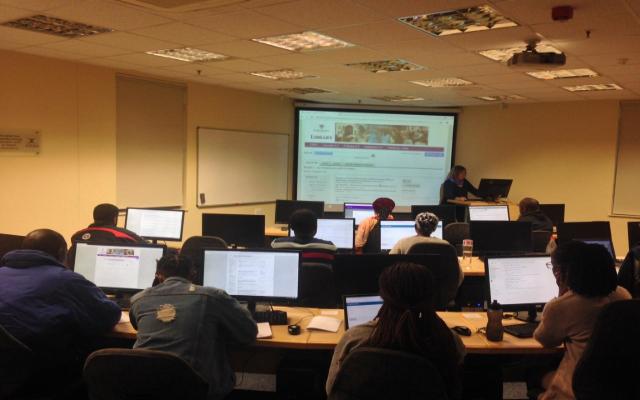 Librarian demonstrating on the use of the library for research purposes