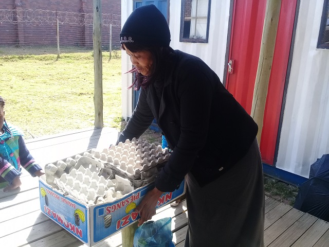 Distributing recycled material for activities at Grahamstown local schools. 