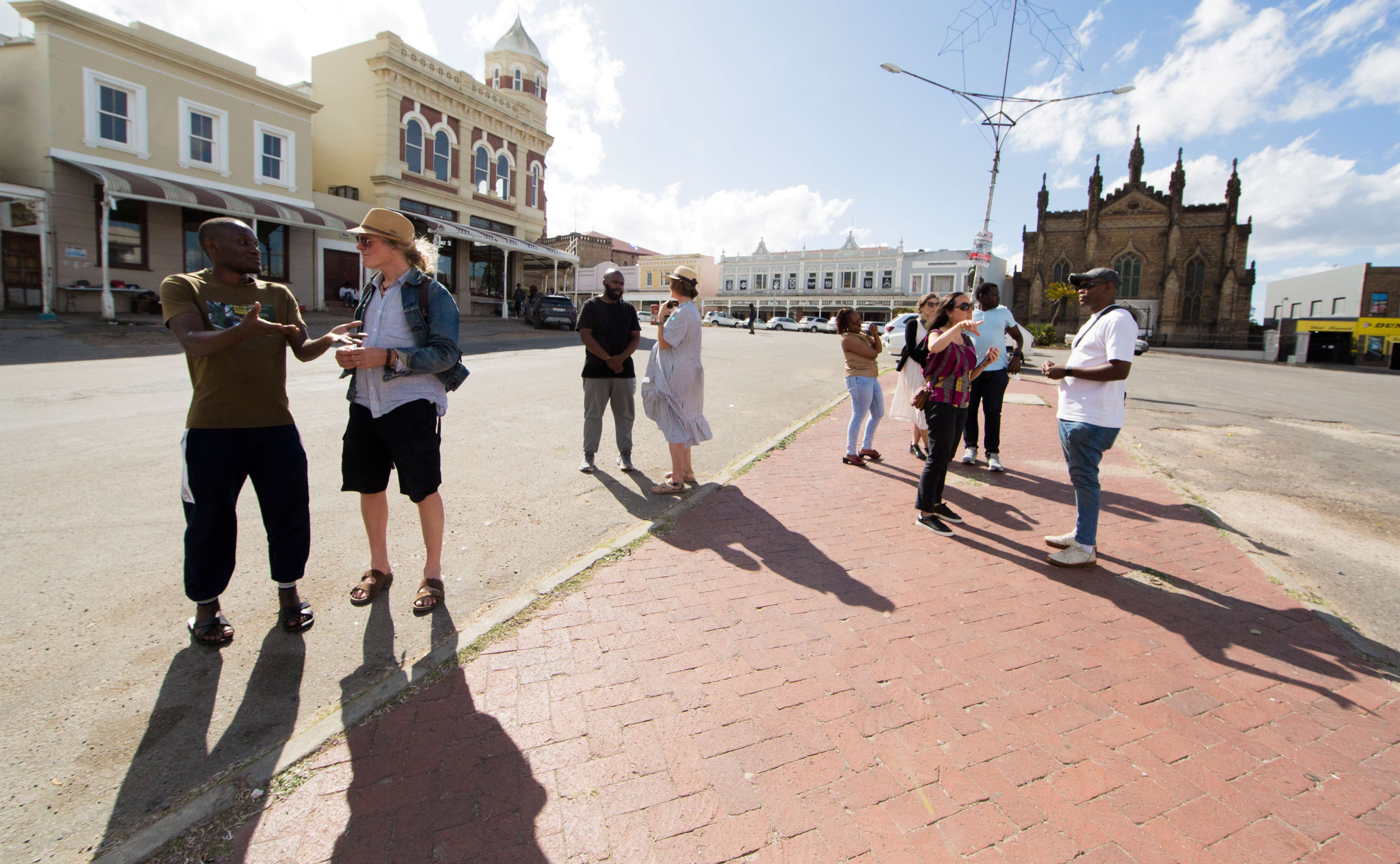 Time Lab workshop participants walked through Makhanda, guided by Luke Kaplan, who pointed out the layered history of the town into the present.