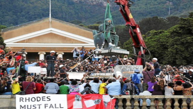 The crowd cheer as the Cecil John Rhodes statue at the University of Cape Town got removed.