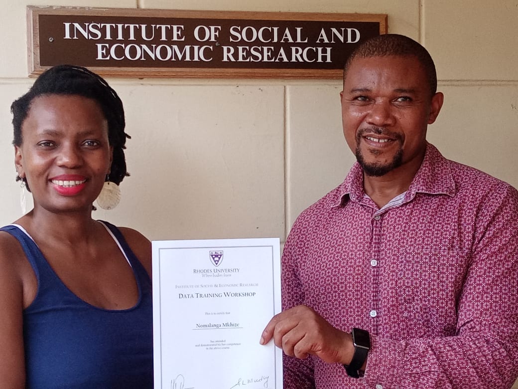 Prof. Nomalanga Mkhize, ISER Board Member and Director of Governmental and Social Sciences at Mandela University accepts certificates on behalf of course participants from Mandela University from the ISER Director, Prof. Cyril Nhlanhla Mbatha. 

