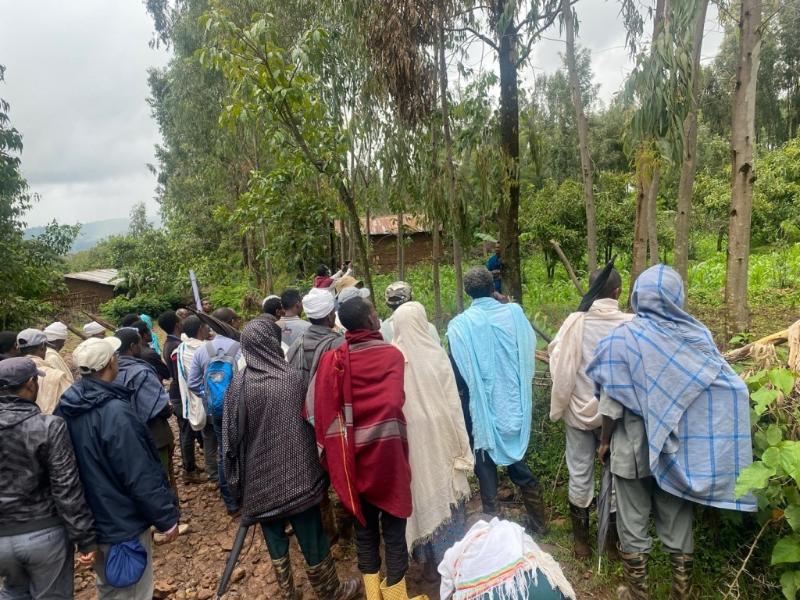 Figure 2: A Debre Yakob watershed farmer telling other farmers about his vegetable and fruit produce in his homestead garden.