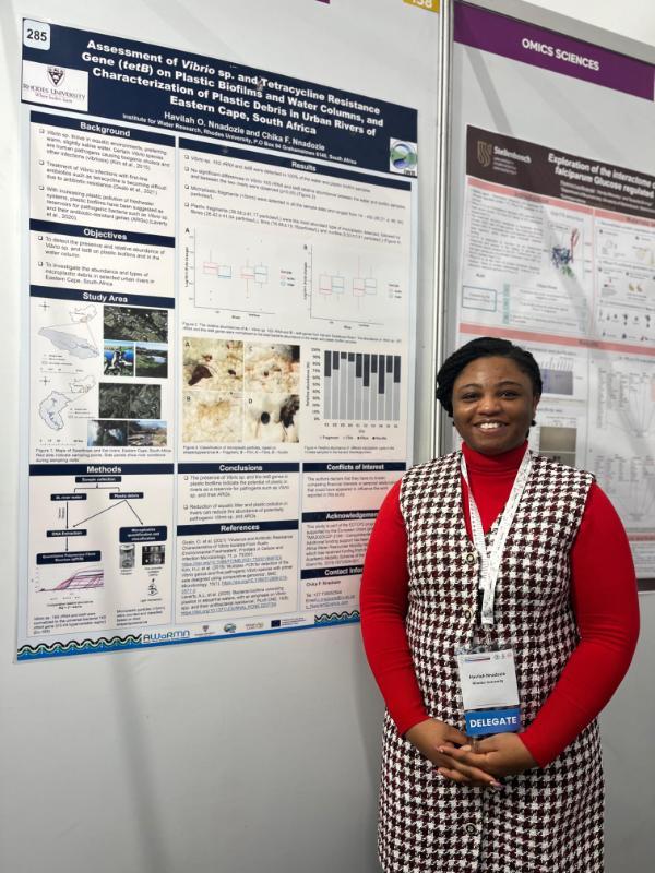 Havilah next to her poster during a poster presentation session at the SASBMB 2024 congress.