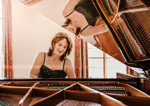 Catherine Foxcroft sitting at the piano