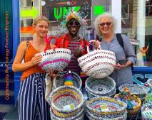 Prof Jacqui Akhurst holding baskets made with recycled plastic