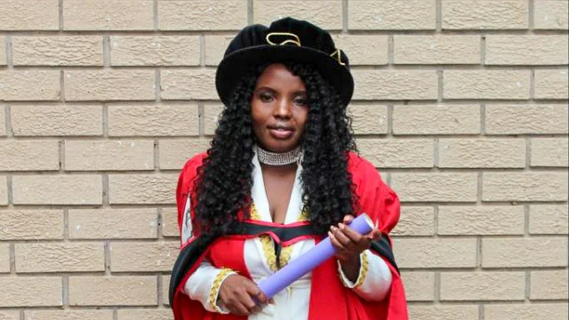 Dr Pindiwe Ntloko proudly holds her PhD parchment