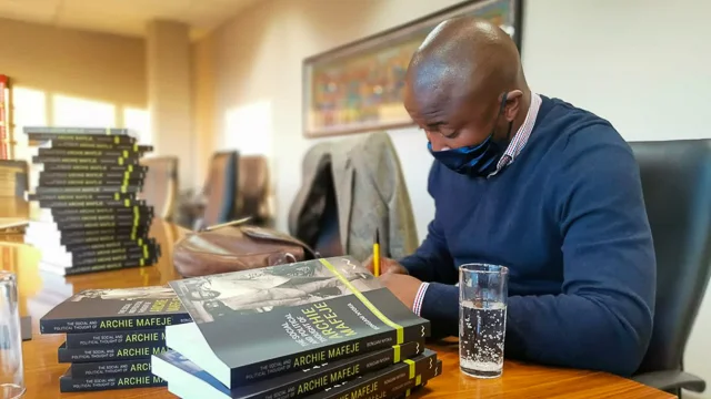 Dr Bongani Nyoka at a book signing [Twitter @nyokabongani]