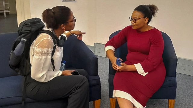 Assistant Director of Scholarship Management at DHET Joy Nogabe discusses international scholarship opportunities with  Rhodes University student