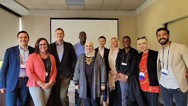 Dr Uzuegbunam (third from right) at the IPIE meeting during the ICA Conference in Toronto, Canada