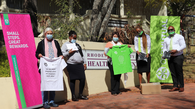 Health Care Centre staff posing with a box of masks and t-shirts from Old Mutual Branch Managers 
