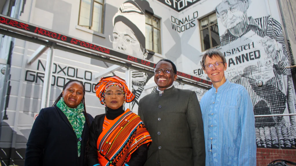 DVC for Research, Innovation & Strategic Partnerships Dr Kwezi Mzilikazi, Dr Noxolo Grootboom, Vice-Chancellor Professor Sizwe Mabizela and JMS Head Dr Jeanne Du Toit in front of the mural. Photo cred: Vusumzi Tshekema. 
