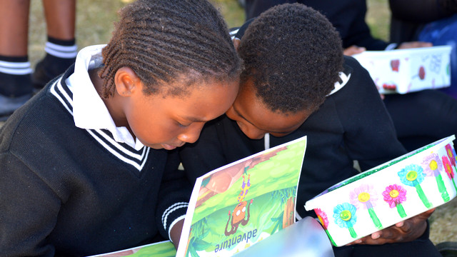 Grade 5 learners with their personal library boxes