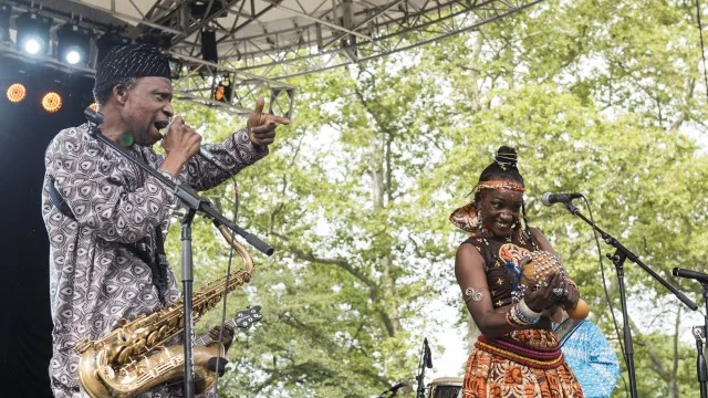 Orlando Julius (left) on stage with his wife, the dancer and singer Latoya Aduke. [Photo by Jack Vartoogian/Getty Images]