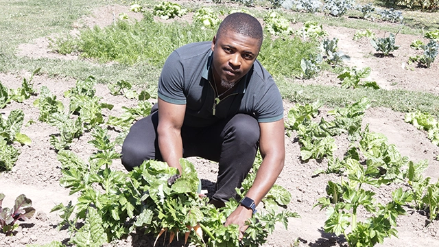 Chuma Songela in the PGV garden