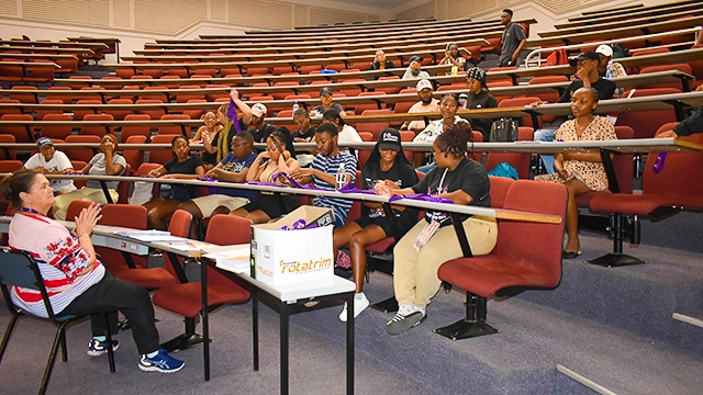 The ushers and other student helpers receive training before the graduation ceremonies