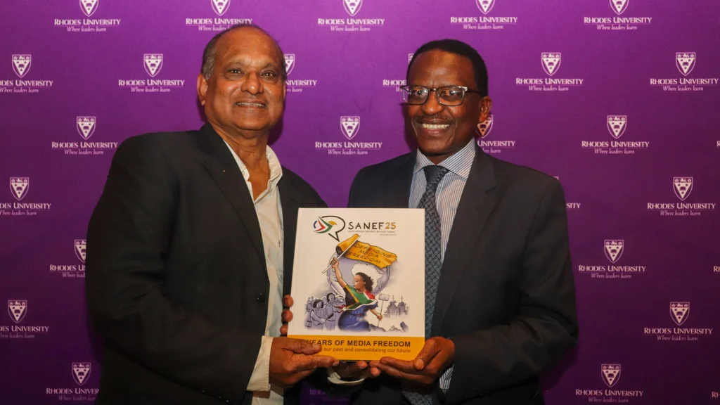 VC receives SANEF's 25 years commemoration book from SANEF KZN associate member, Marlan Padayachee