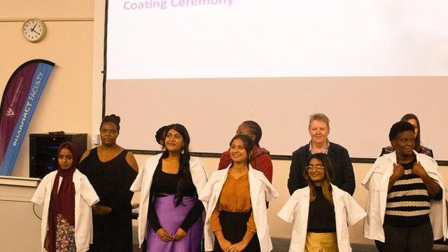 Pharmacy students receive their white coats