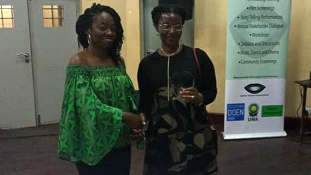 Dr Amanda Tumusiime (R) receiving her award